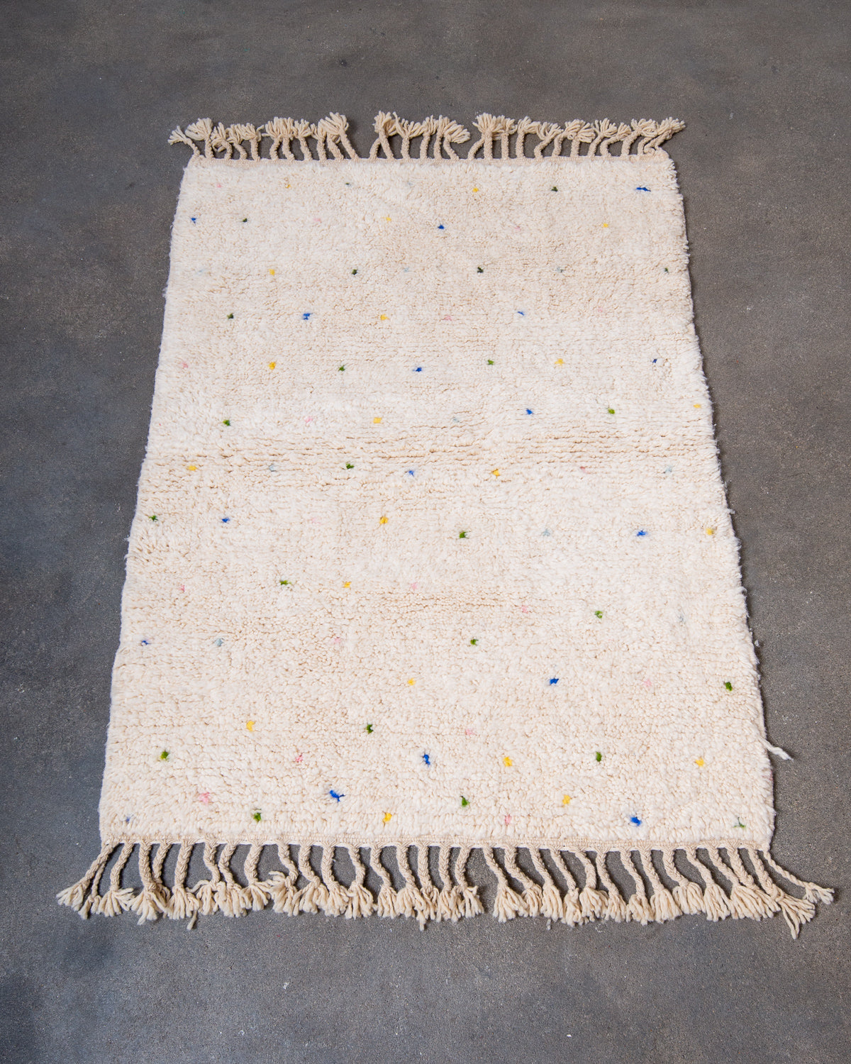 Modern, designer, handcrafted Berber rug from Morocco. Beniourain carpet with beautiful colours and patterns and fluffy wool texture.